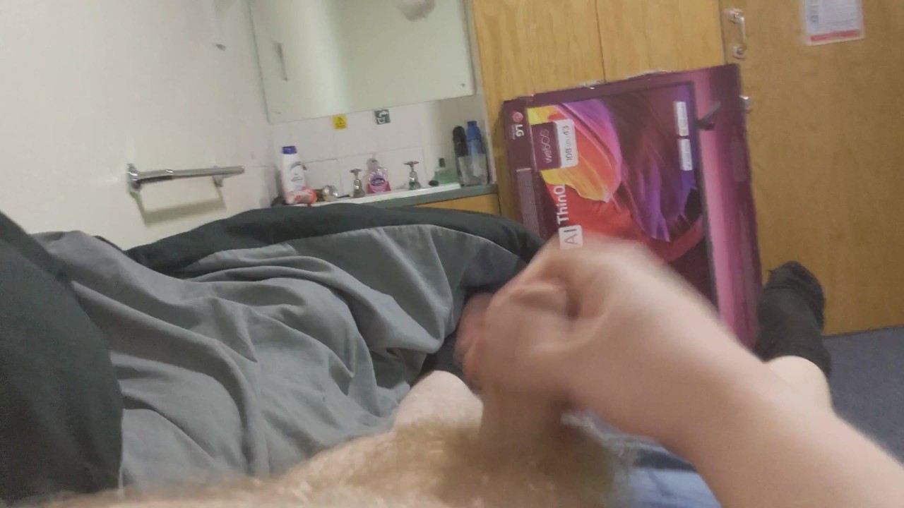 Chubby Guy Jerks Off to Cumshot in Dorm Room