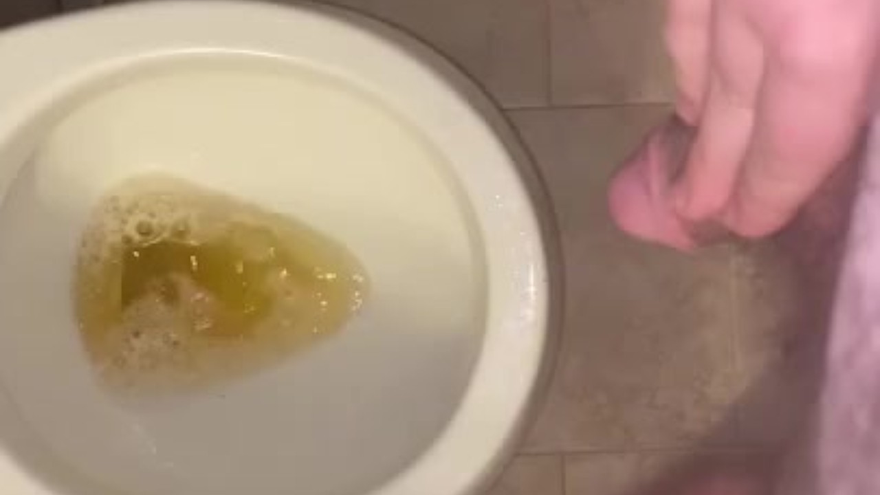 Guy Urinates in Toilet