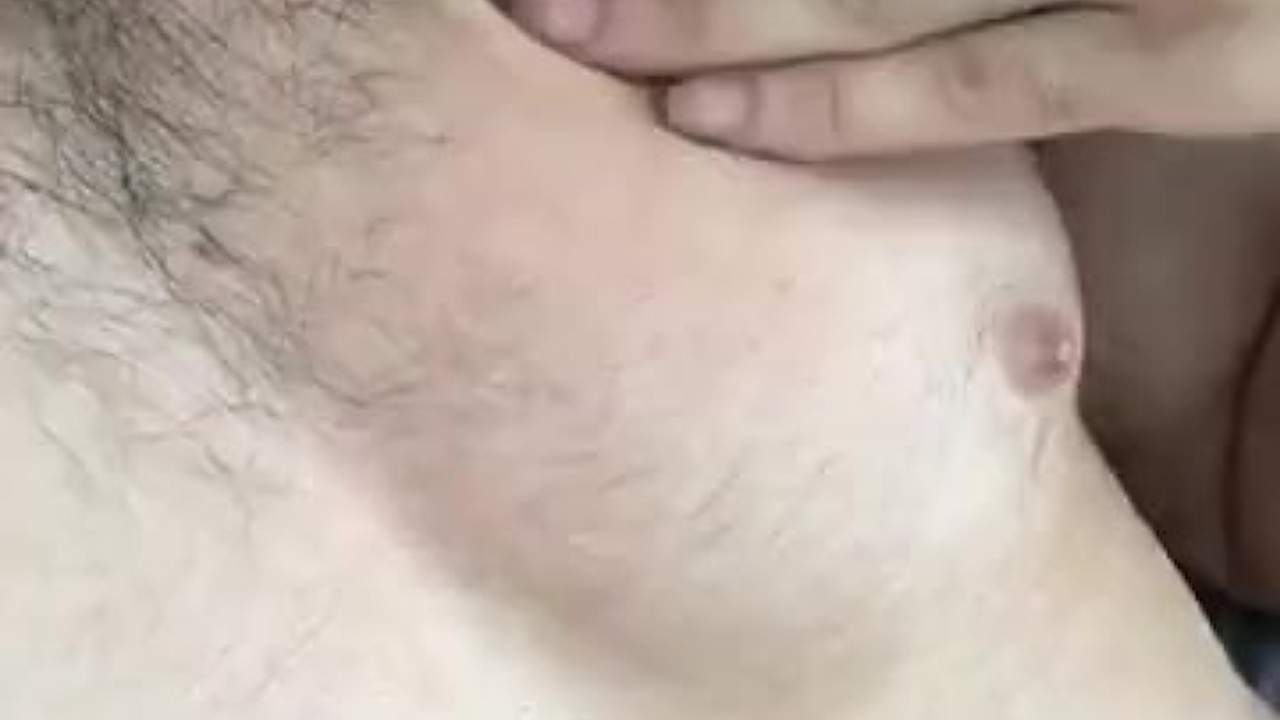 Hairy Chested Man Rubs His Muscles