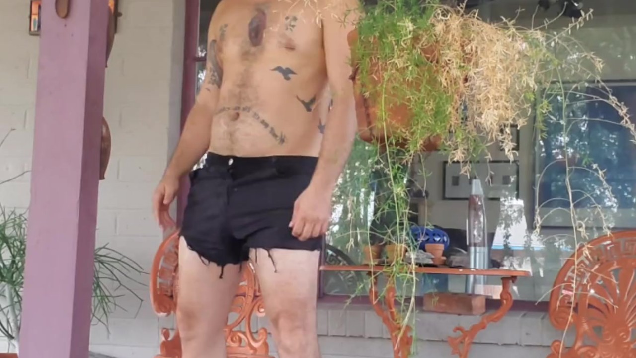 Hippie Guy Urinates in Garden