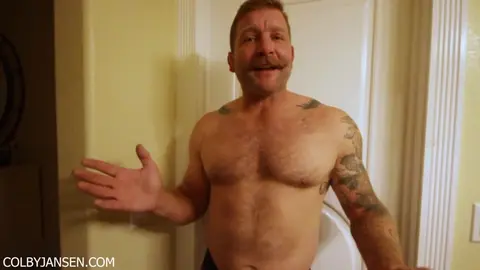 Hairy Beefcake Shows Off Huge Dildo Collection