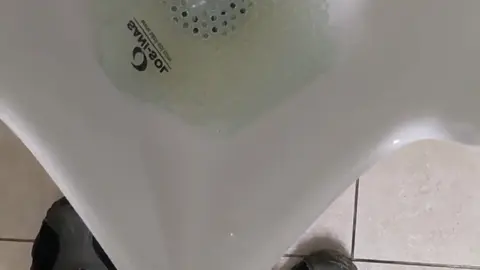 Guy Pisses at Office Desk