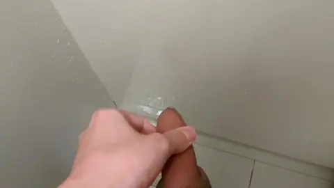 Uncut Guy Marks Wall with Cum