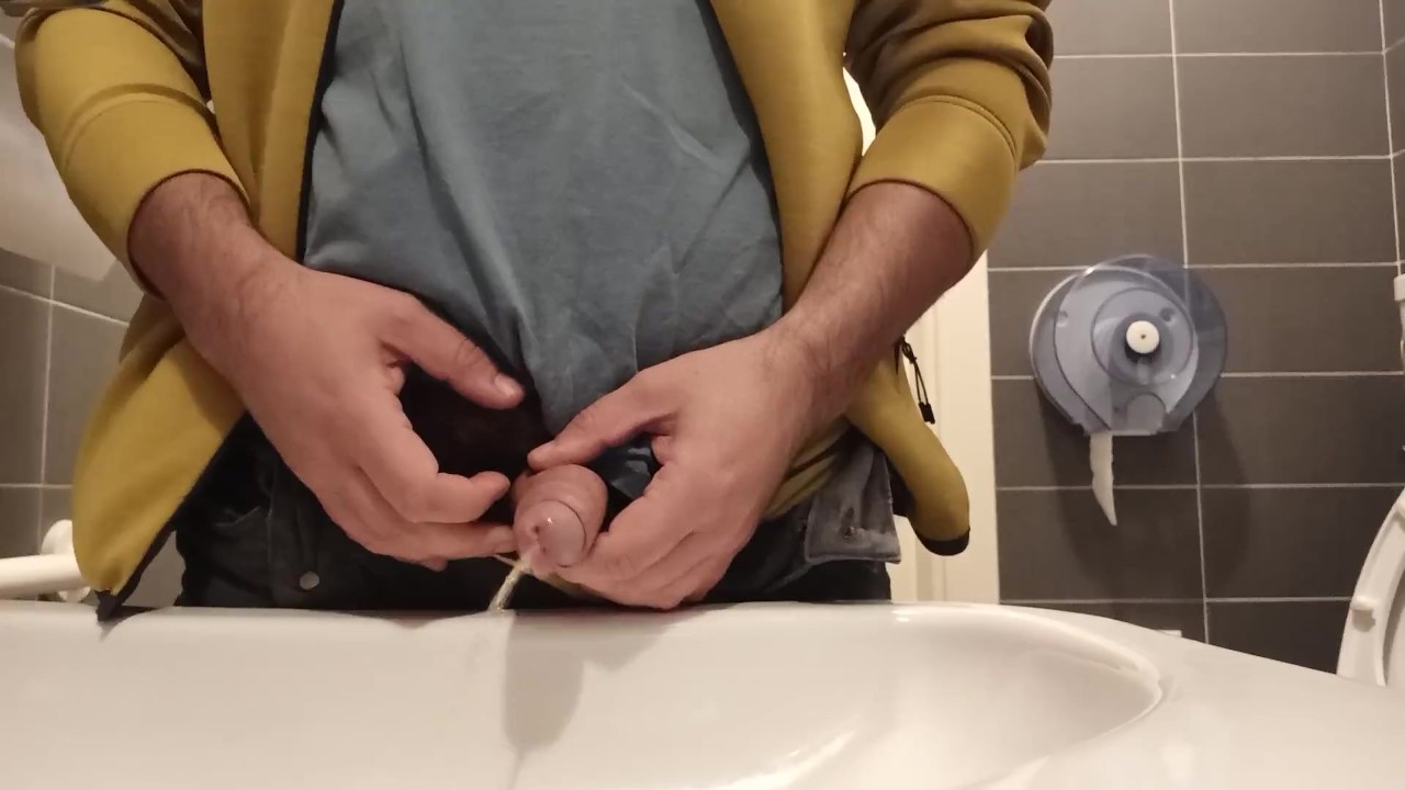 Guy Urinates in Public Toilet Sink