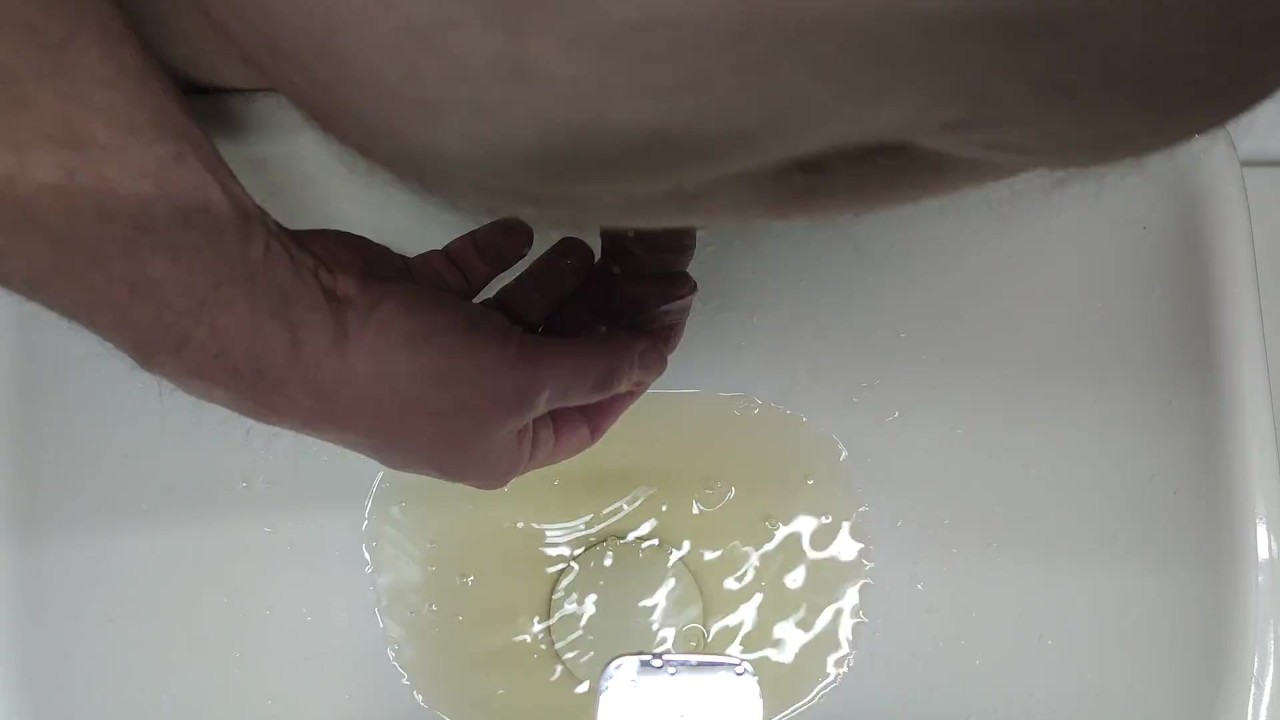 Guy Pisses into Sink and on Foreskin