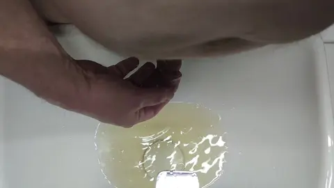 Guy Pisses into Sink and on Foreskin