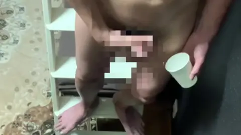 Guy Masturbates on Ladder, Finishes in Paper Cup