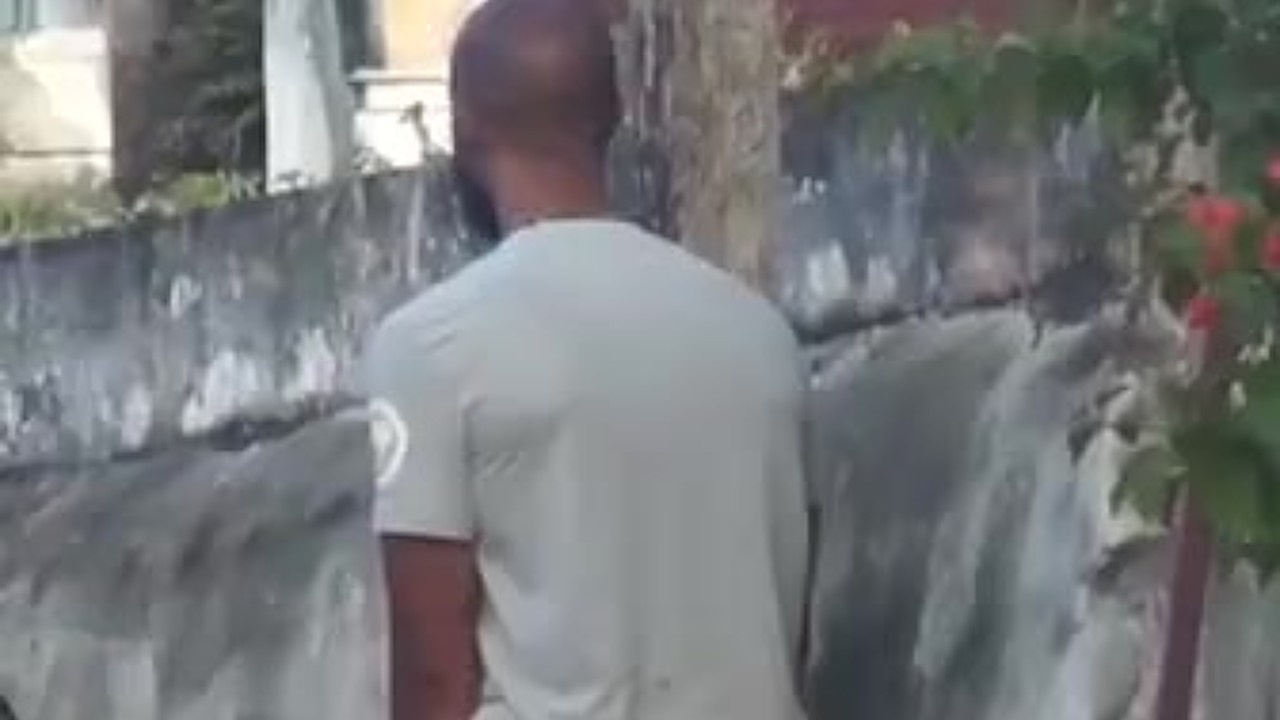 Jamaican Guy Urinates in Public Place