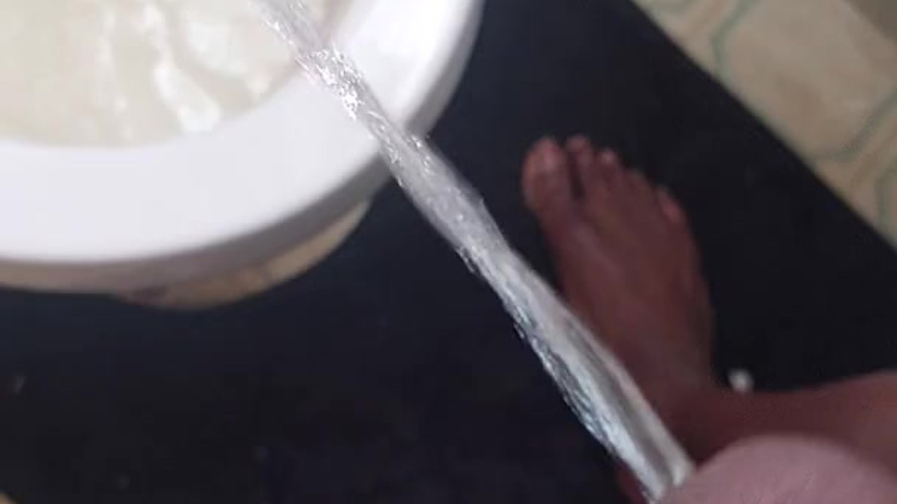 Hunky Guy Pisses with Huge Cock Exposed