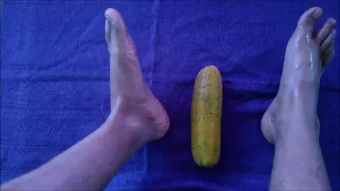 Guy Masturbates with Feet on Cucumber