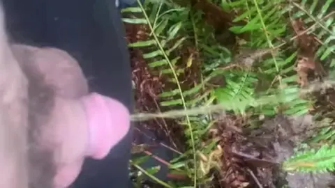 Guy Urinates Near Waterfall