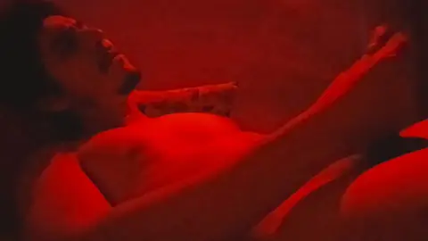 Guy Masturbates Under Red Light