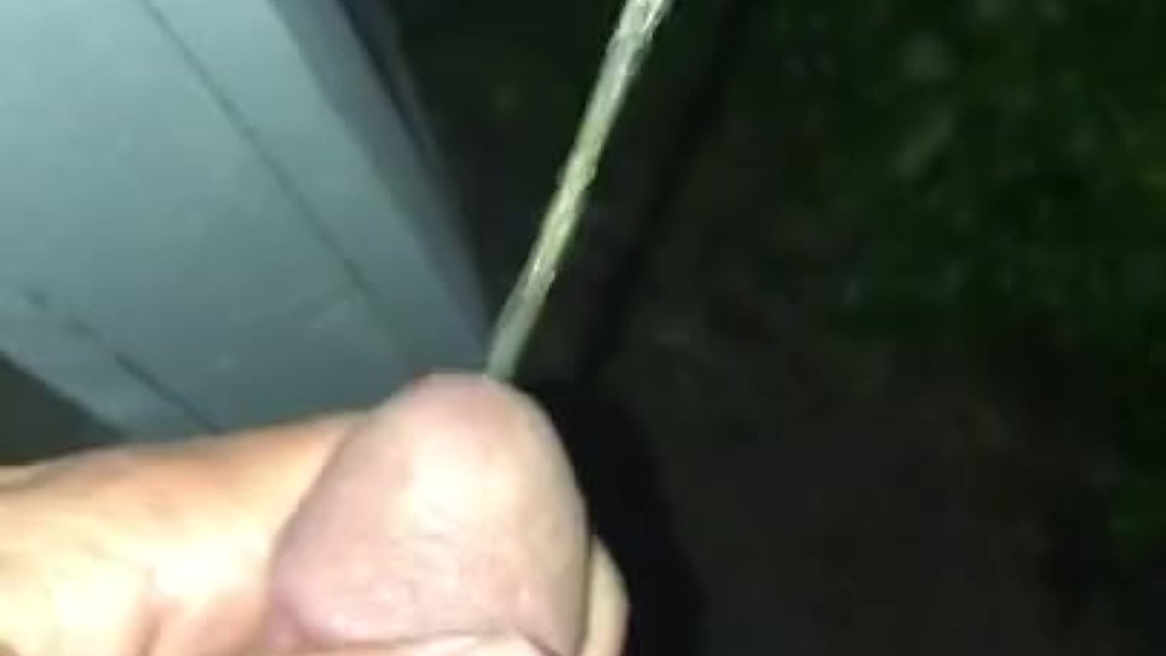 Stud Urinates Off Front Porch at Night