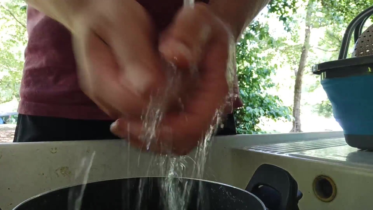 Guy Pisses While Washing Dishes