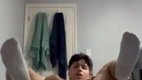 Twink Fucks Himself with Hand in Dark Bedroom